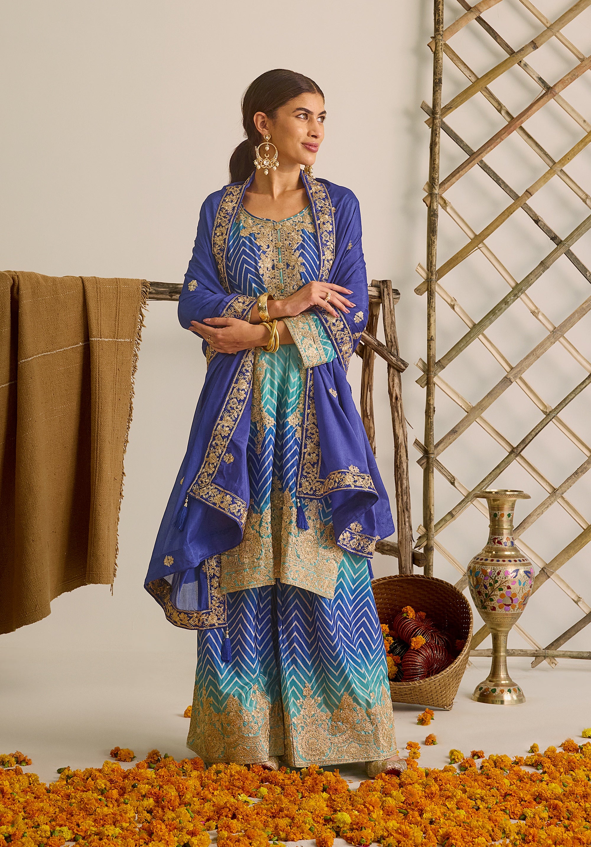 Royal blue and sky blue Leher suit Indian ethnic wear: premium chiffon silk with gold floral embroidery, gradient leheriya palazzo, tassel dupatta, buy salwar kameez online for ethereal vibe.