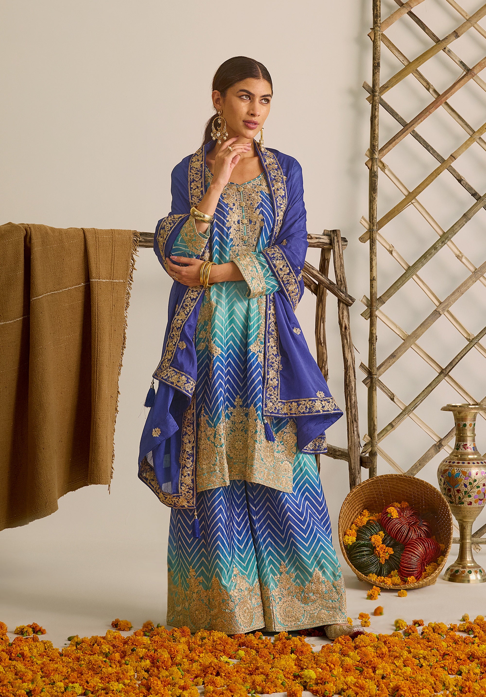 Royal blue and sky blue Leher suit Indian ethnic wear: premium chiffon silk with gold floral embroidery, gradient leheriya palazzo, tassel dupatta, buy salwar kameez online for ethereal vibe.