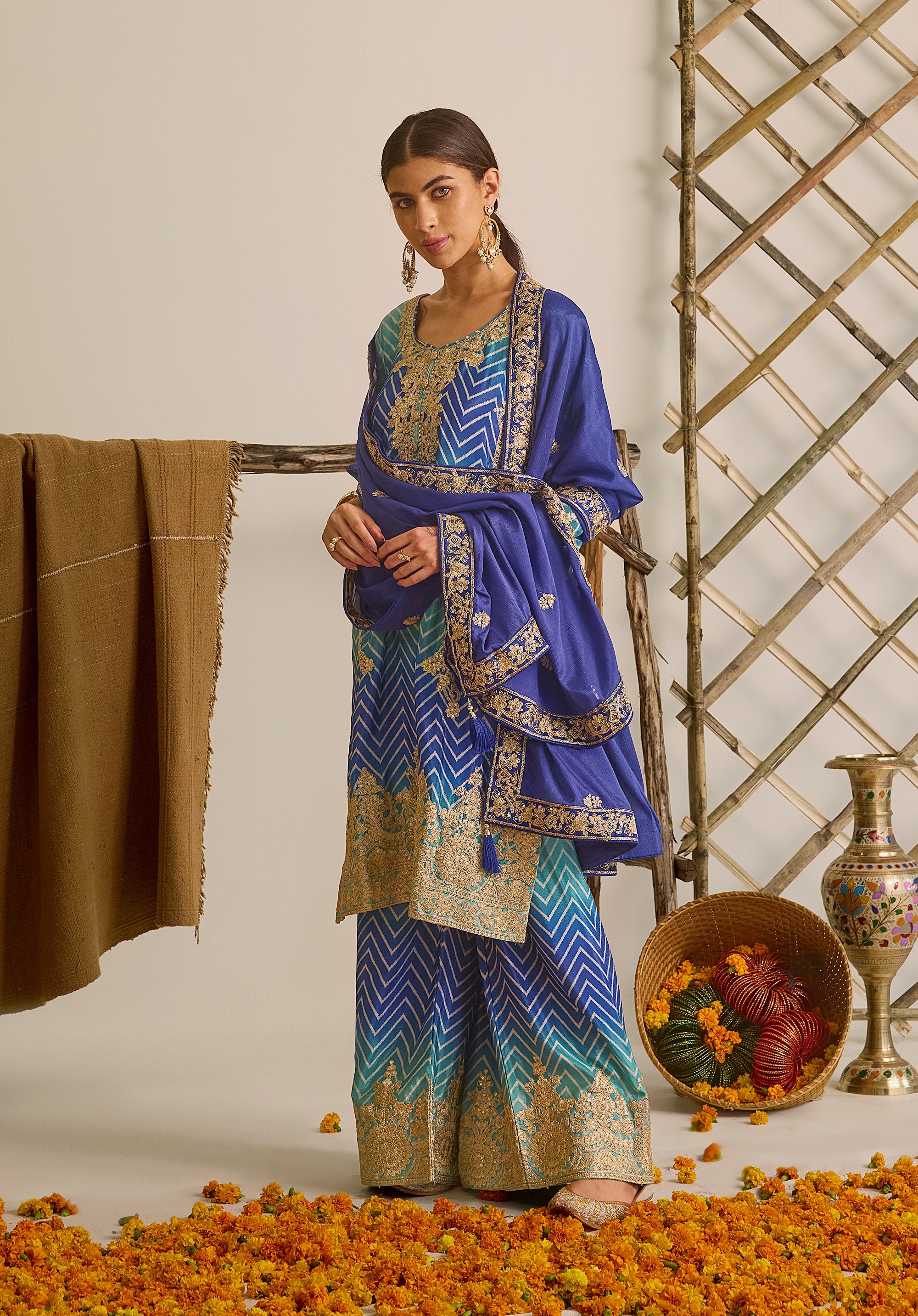 Royal blue and sky blue Leher suit Indian ethnic wear: premium chiffon silk with gold floral embroidery, gradient leheriya palazzo, tassel dupatta, buy salwar kameez online for ethereal vibe.
