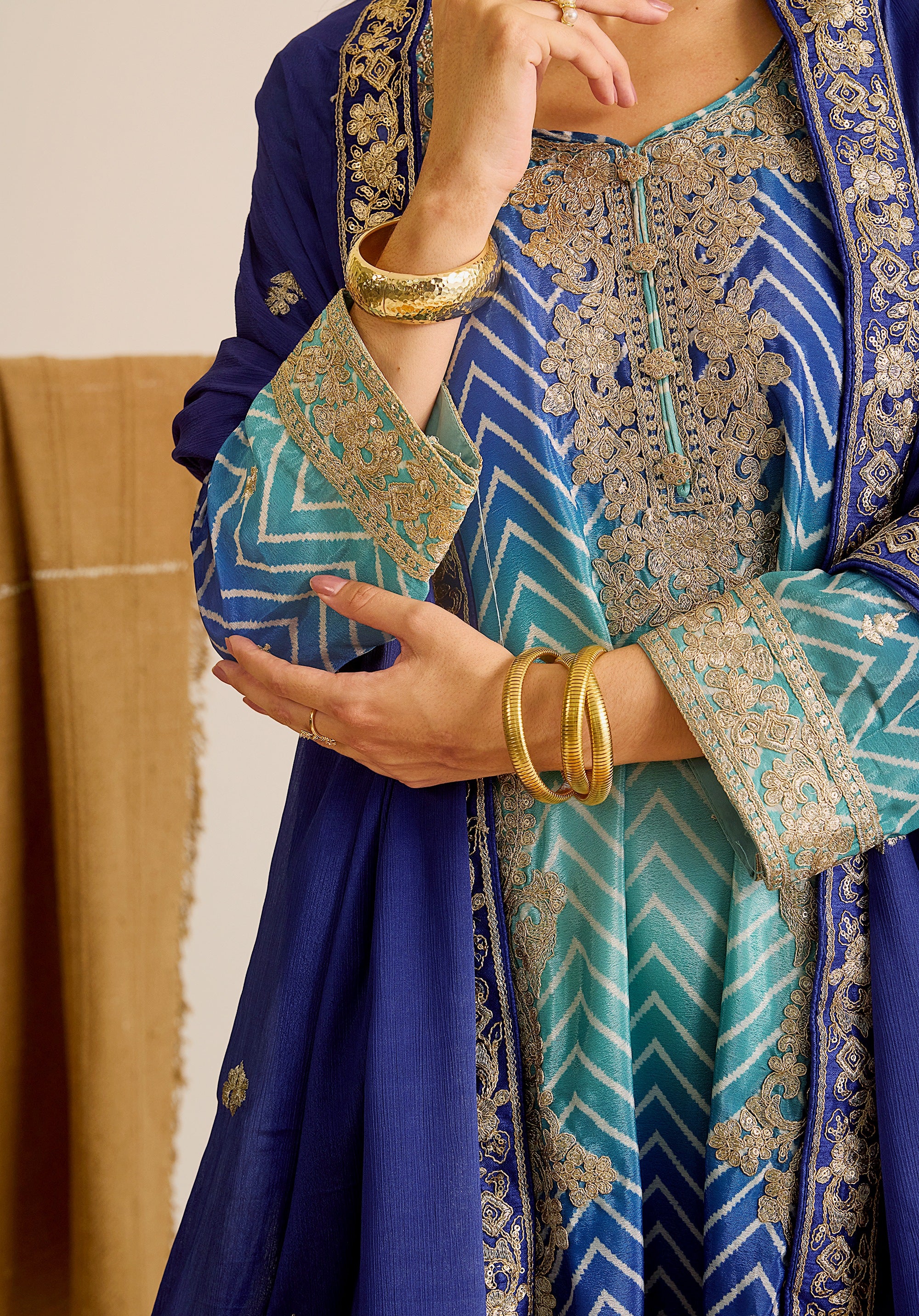 Royal blue and sky blue Leher suit Indian ethnic wear: premium chiffon silk with gold floral embroidery, gradient leheriya palazzo, tassel dupatta, buy salwar kameez online for ethereal vibe.