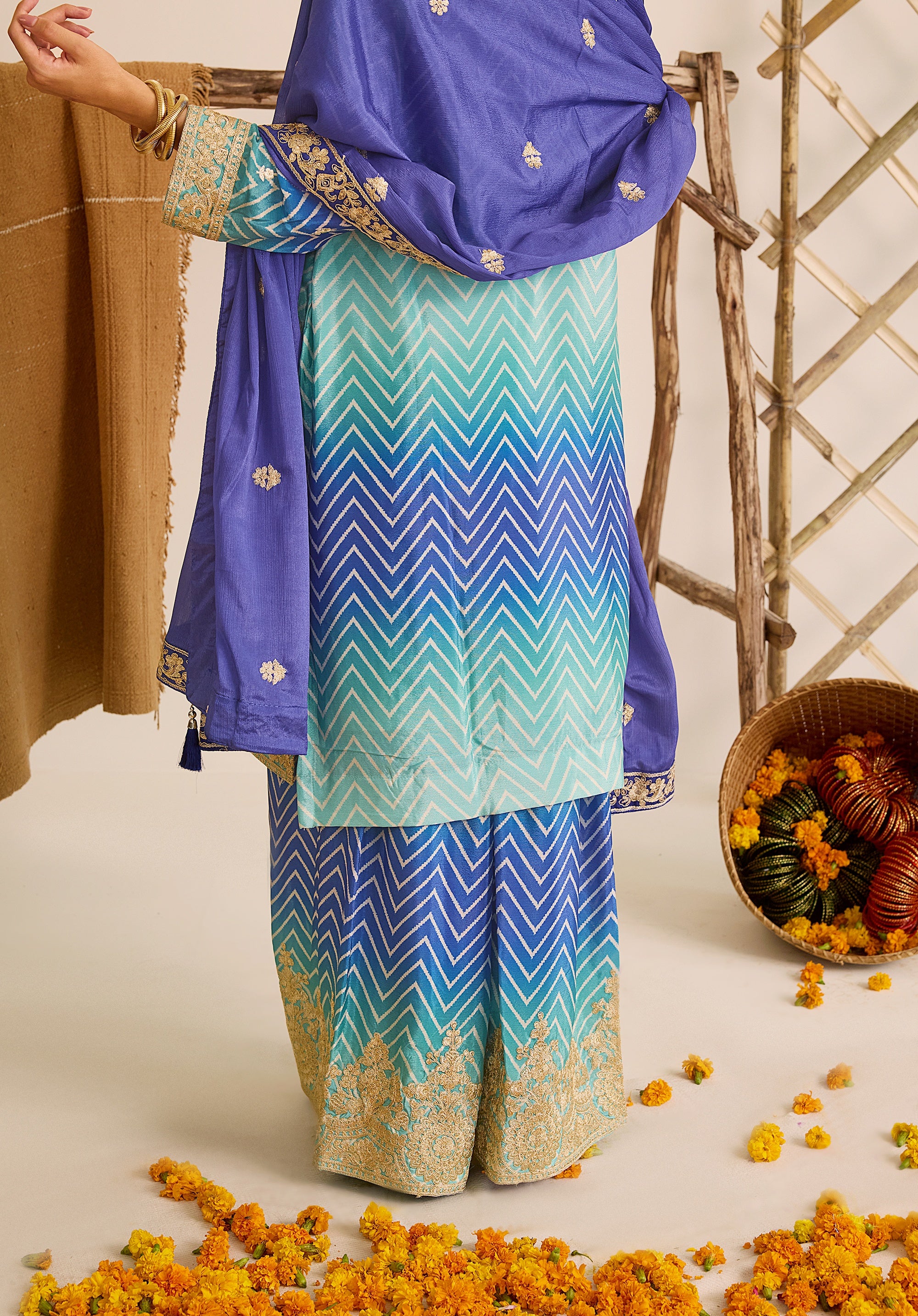 Royal blue and sky blue Leher suit Indian ethnic wear: premium chiffon silk with gold floral embroidery, gradient leheriya palazzo, tassel dupatta, buy salwar kameez online for ethereal vibe.