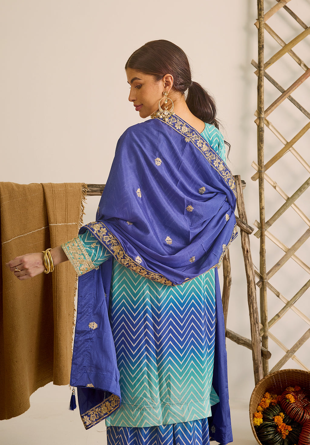 Royal blue and sky blue Leher suit Indian ethnic wear: premium chiffon silk with gold floral embroidery, gradient leheriya palazzo, tassel dupatta, buy salwar kameez online for ethereal vibe.