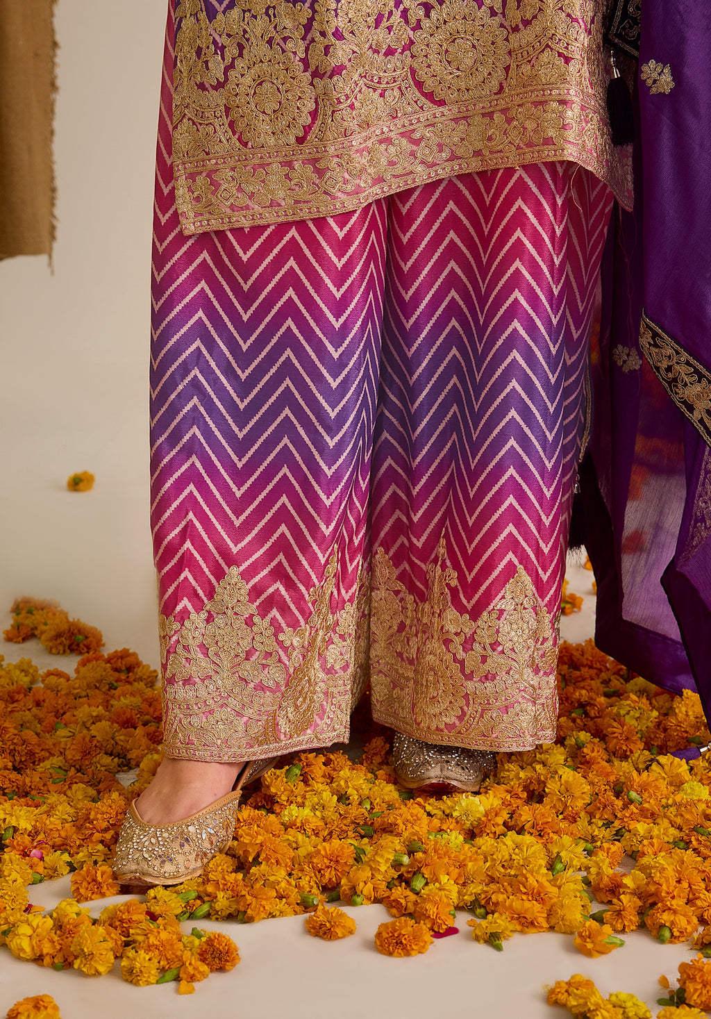 Magenta pink and royal purple Gulzaar suit Indian ethnic wear: premium chiffon silk with gold floral embroidery, gradient leheriya palazzo, tassel dupatta, buy salwar kameez online Gujarat inspired.