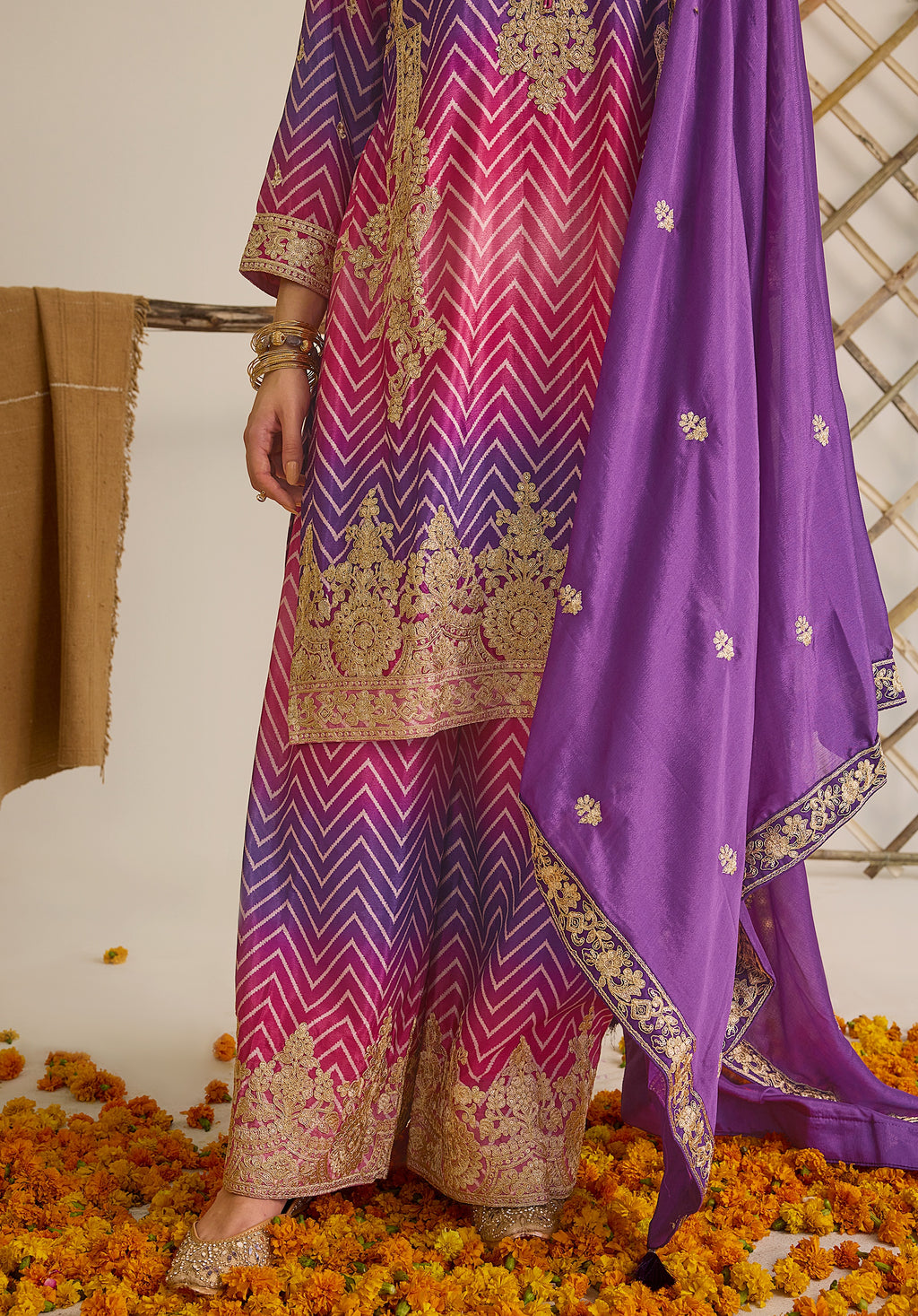 Magenta pink and royal purple Gulzaar suit Indian ethnic wear: premium chiffon silk with gold floral embroidery, gradient leheriya palazzo, tassel dupatta, buy salwar kameez online Gujarat inspired.