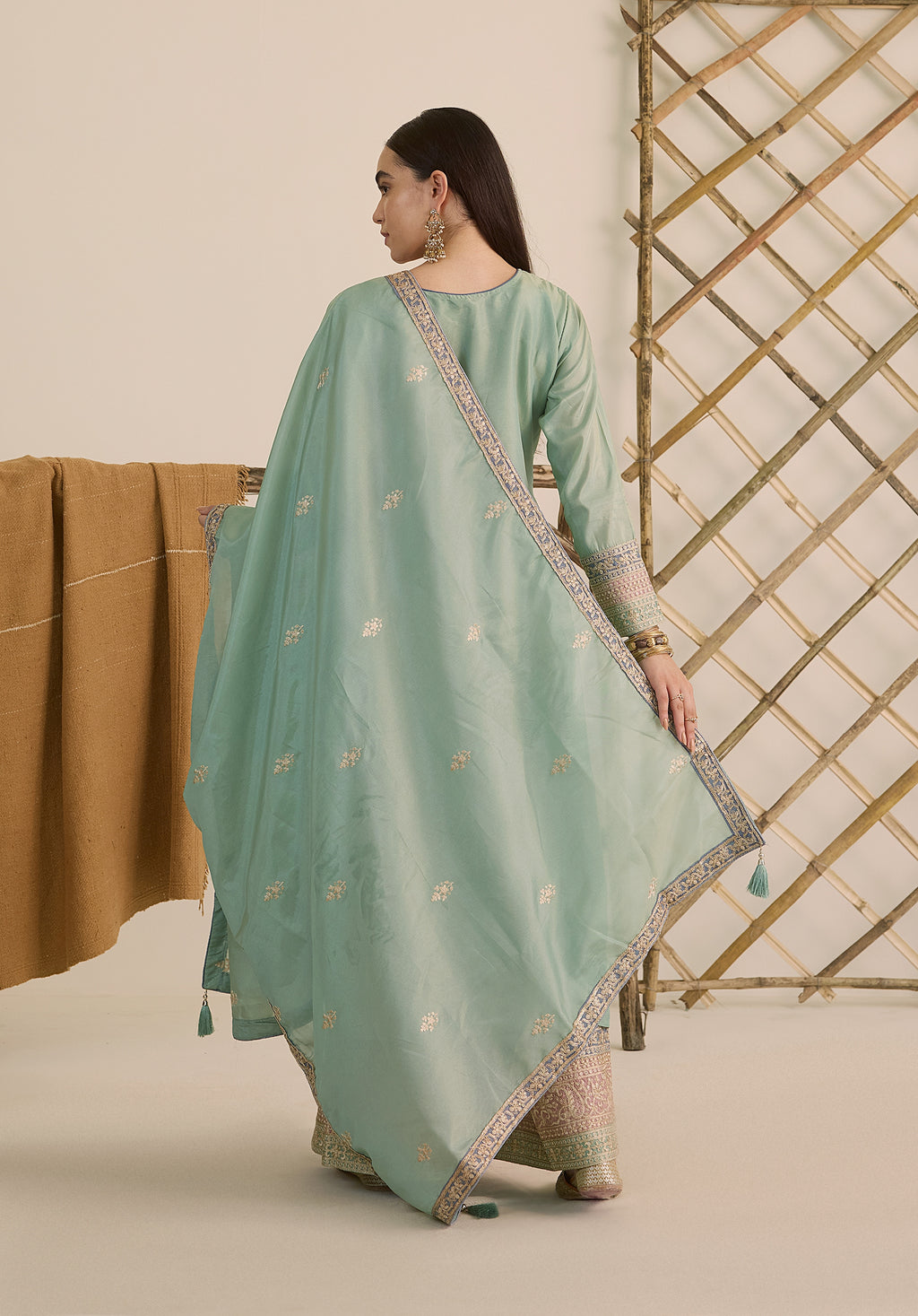 Mint green Vaidehi suit Indian ethnic wear: premium silk with gold floral zardozi embroidery, ornate printed palazzo, graceful dupatta, buy salwar kameez online with intricate gotta details.