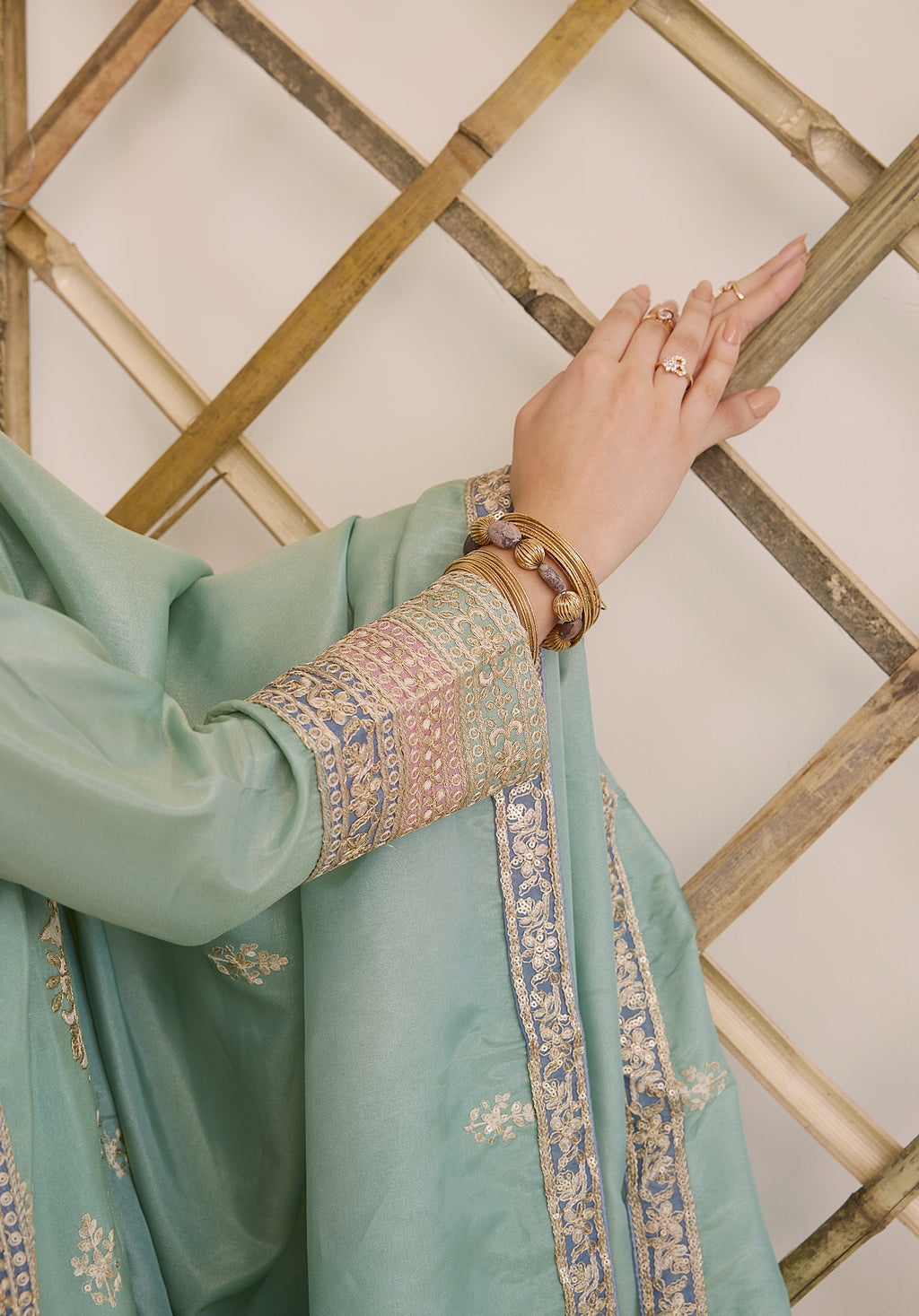 Mint green Vaidehi suit Indian ethnic wear: premium silk with gold floral zardozi embroidery, ornate printed palazzo, graceful dupatta, buy salwar kameez online with intricate gotta details.