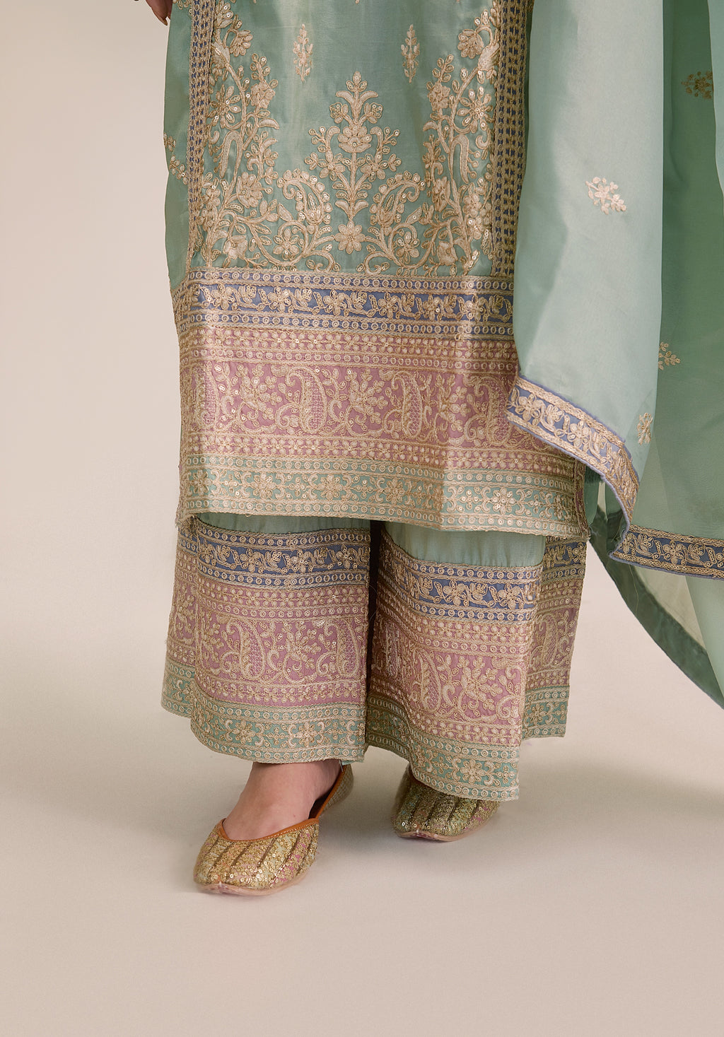 Mint green Vaidehi suit Indian ethnic wear: premium silk with gold floral zardozi embroidery, ornate printed palazzo, graceful dupatta, buy salwar kameez online with intricate gotta details.