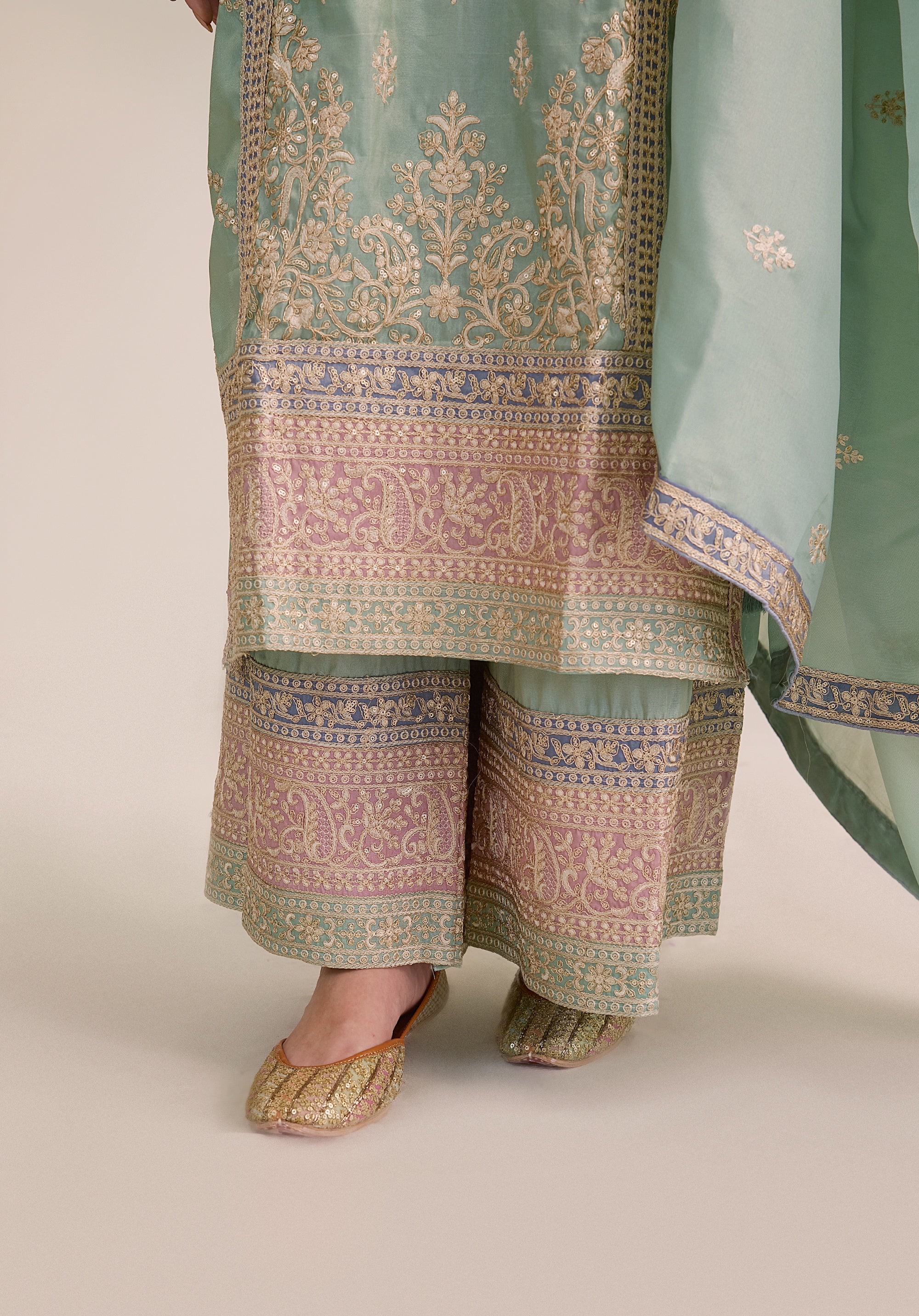 Mint green Vaidehi suit Indian ethnic wear: premium silk with gold floral zardozi embroidery, ornate printed palazzo, graceful dupatta, buy salwar kameez online with intricate gotta details.