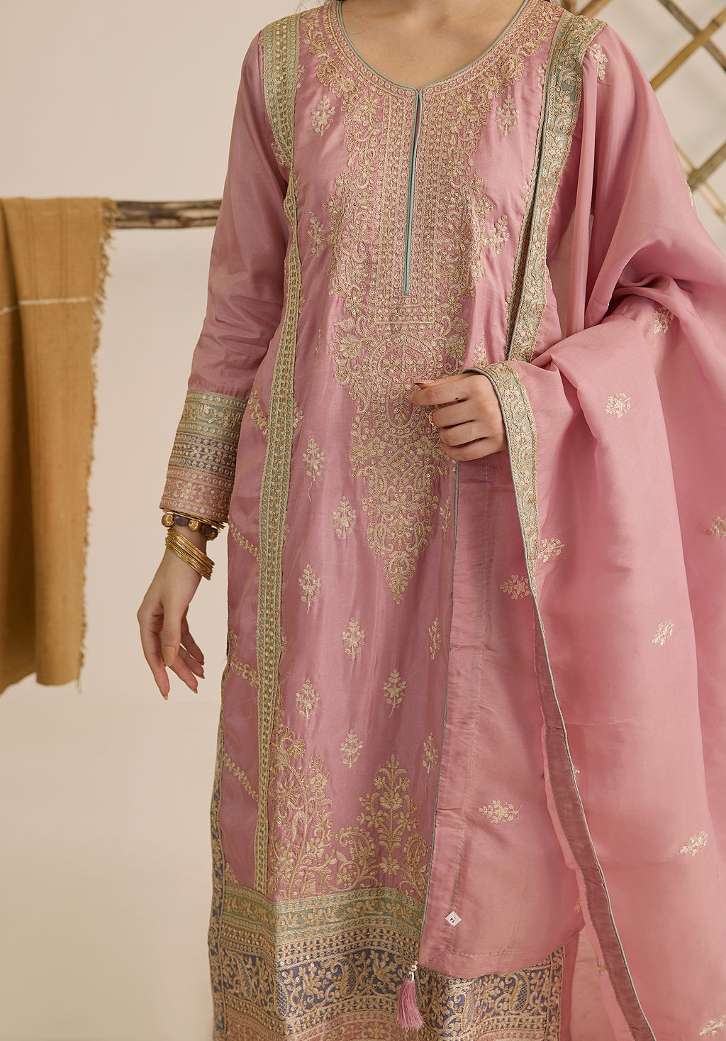 Pastel pink Inaayat suit Indian ethnic wear: premium silk with gold floral zardozi work, printed palazzo gold borders, embellished dupatta, buy salwar kameez online with gotta detailing.