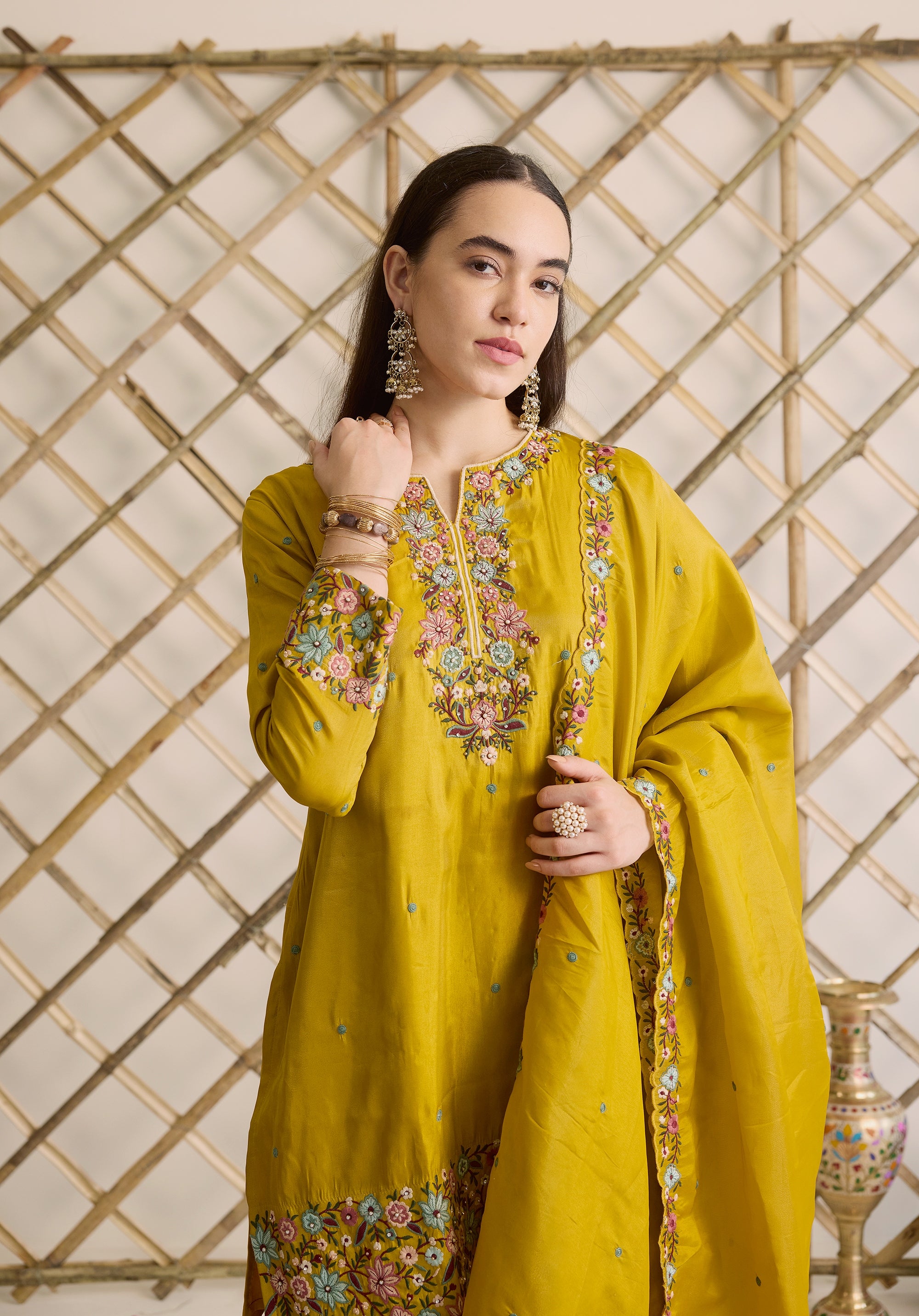 Mustard yellow Nitya suit Indian ethnic wear: premium silk with gold floral zardozi embroidery, ornate printed palazzo, graceful dupatta, buy salwar kameez online with floral designs.