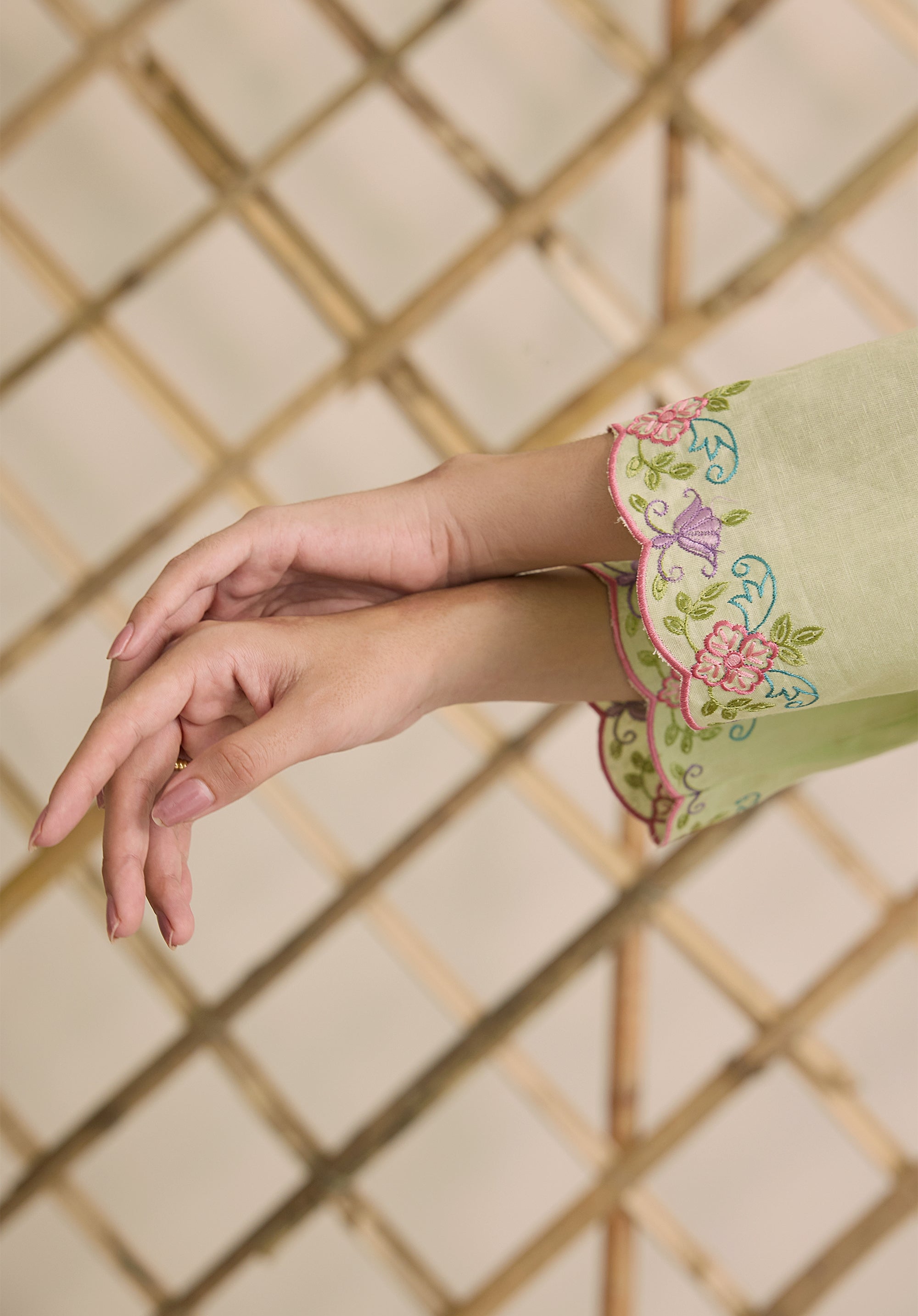 Light sage green Noor Kashmiri suit Indian ethnic wear: premium cotton with multicolored floral motifs, tailored straight pants, star-embroidered dupatta, buy salwar kameez online Kashmir collection.