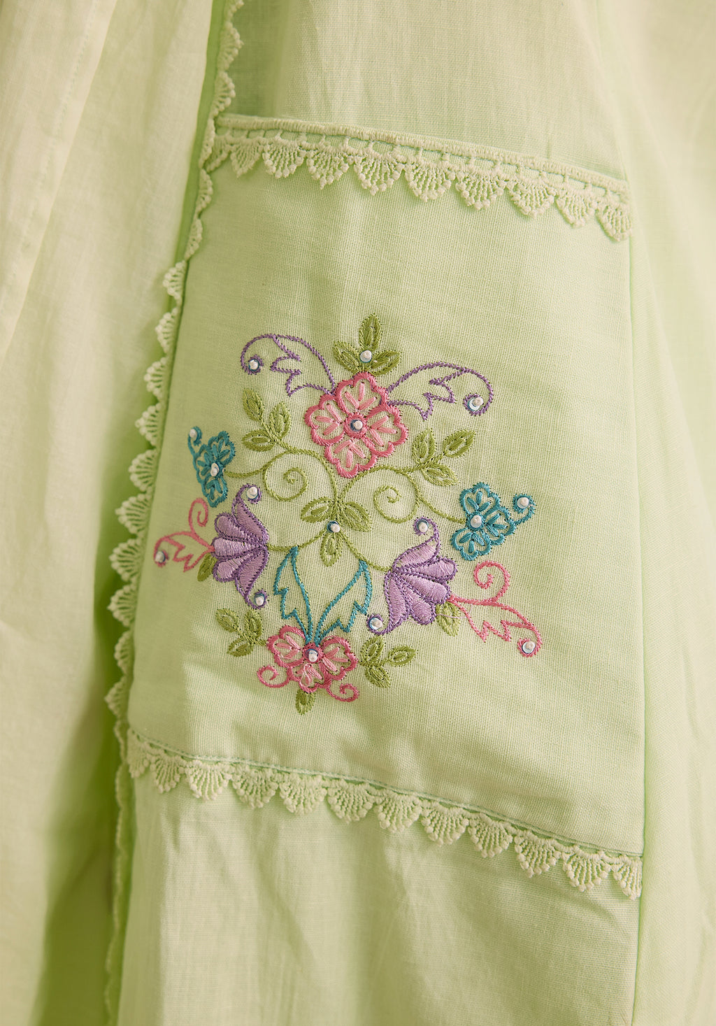 Light sage green Noor Kashmiri suit Indian ethnic wear: premium cotton with multicolored floral motifs, tailored straight pants, star-embroidered dupatta, buy salwar kameez online Kashmir collection.
