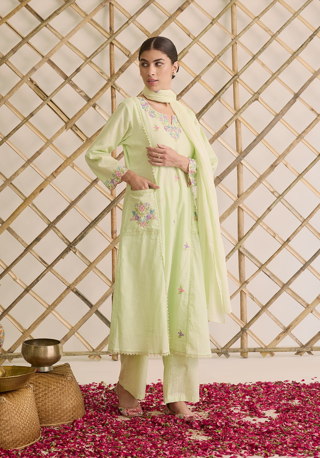 Light sage green Noor Kashmiri suit Indian ethnic wear: premium cotton with multicolored floral motifs, tailored straight pants, star-embroidered dupatta, buy salwar kameez online Kashmir collection.