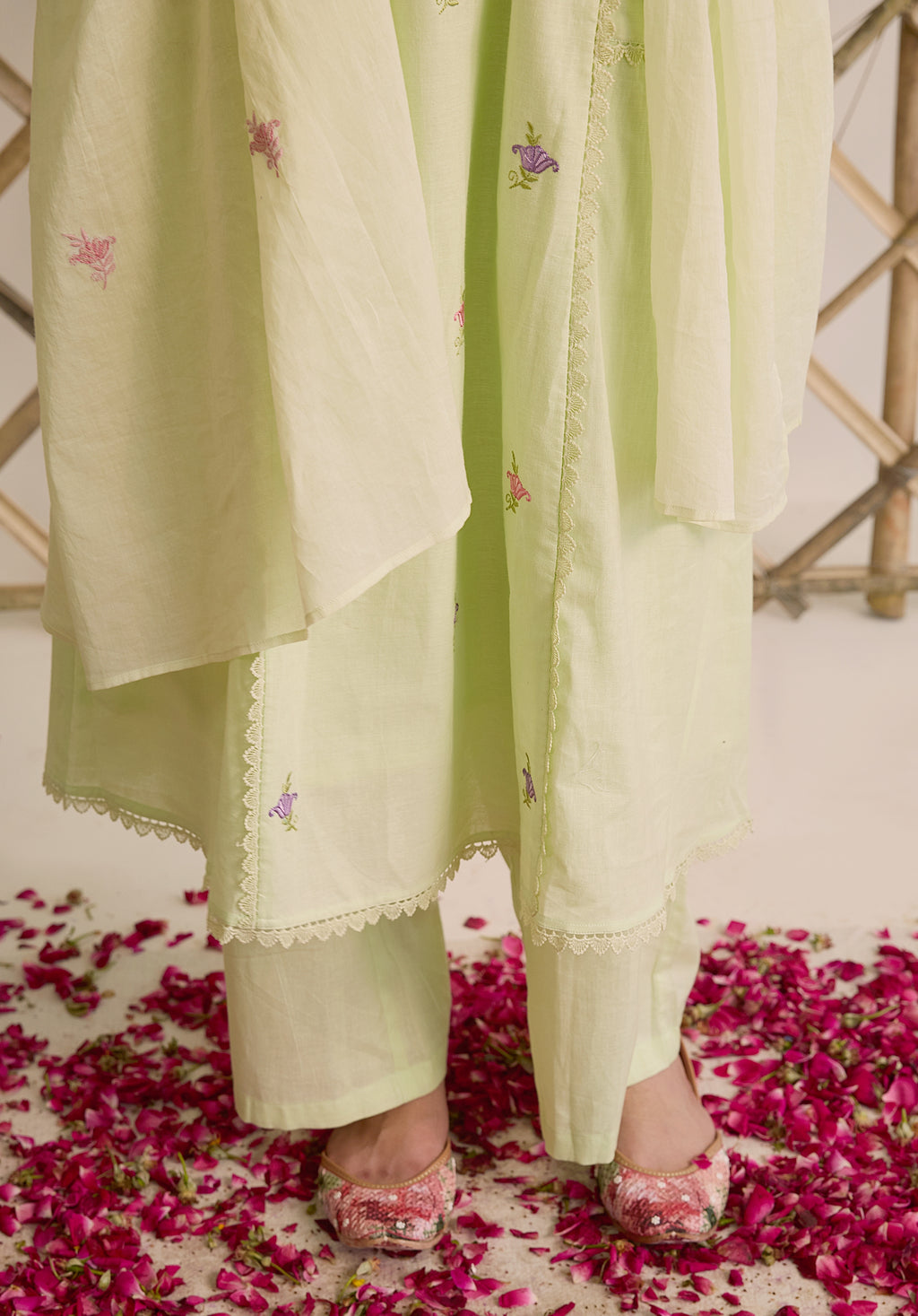 Light sage green Noor Kashmiri suit Indian ethnic wear: premium cotton with multicolored floral motifs, tailored straight pants, star-embroidered dupatta, buy salwar kameez online Kashmir collection.