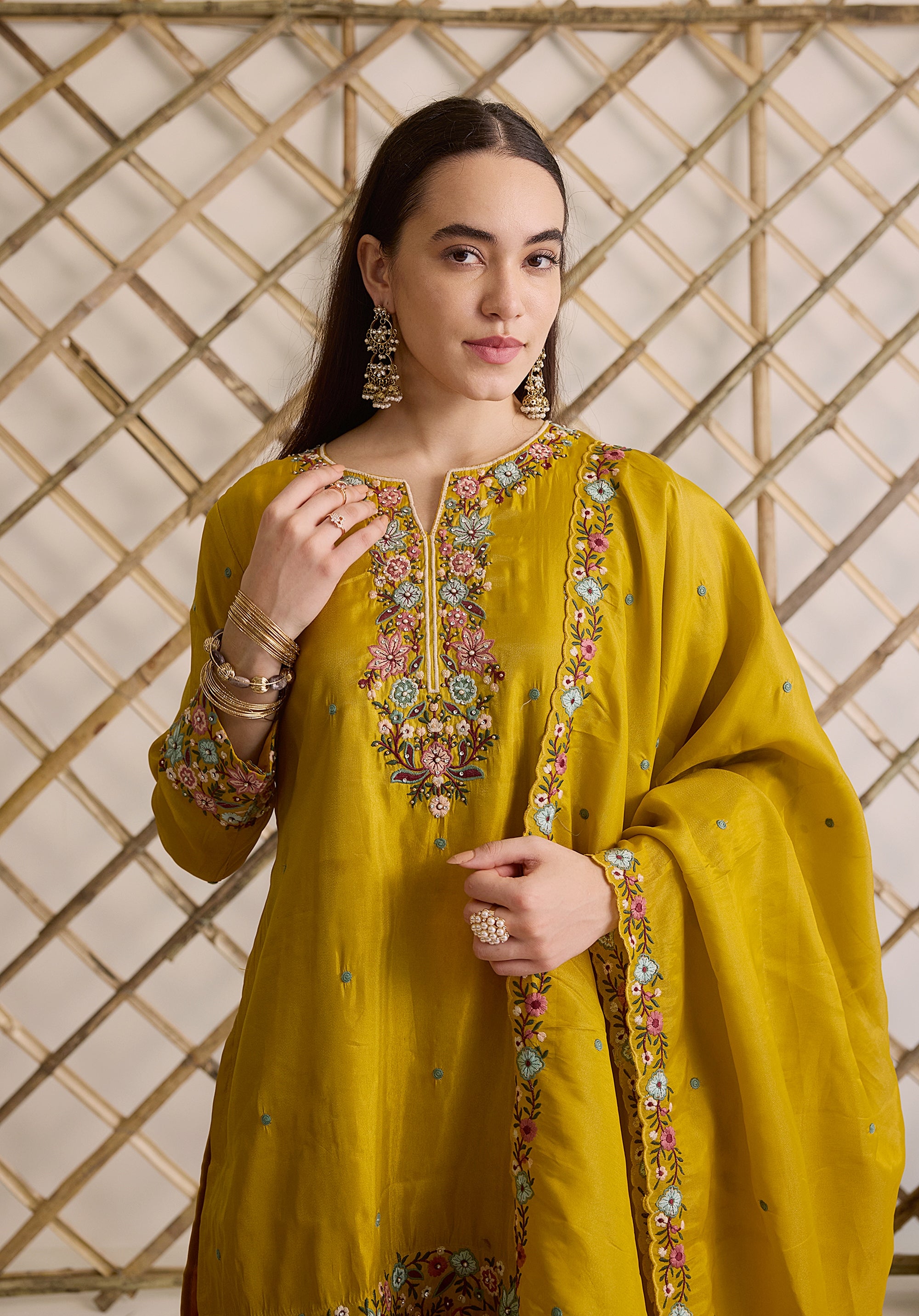 Mustard yellow Nitya suit Indian ethnic wear: premium silk with gold floral zardozi embroidery, ornate printed palazzo, graceful dupatta, buy salwar kameez online with floral designs.